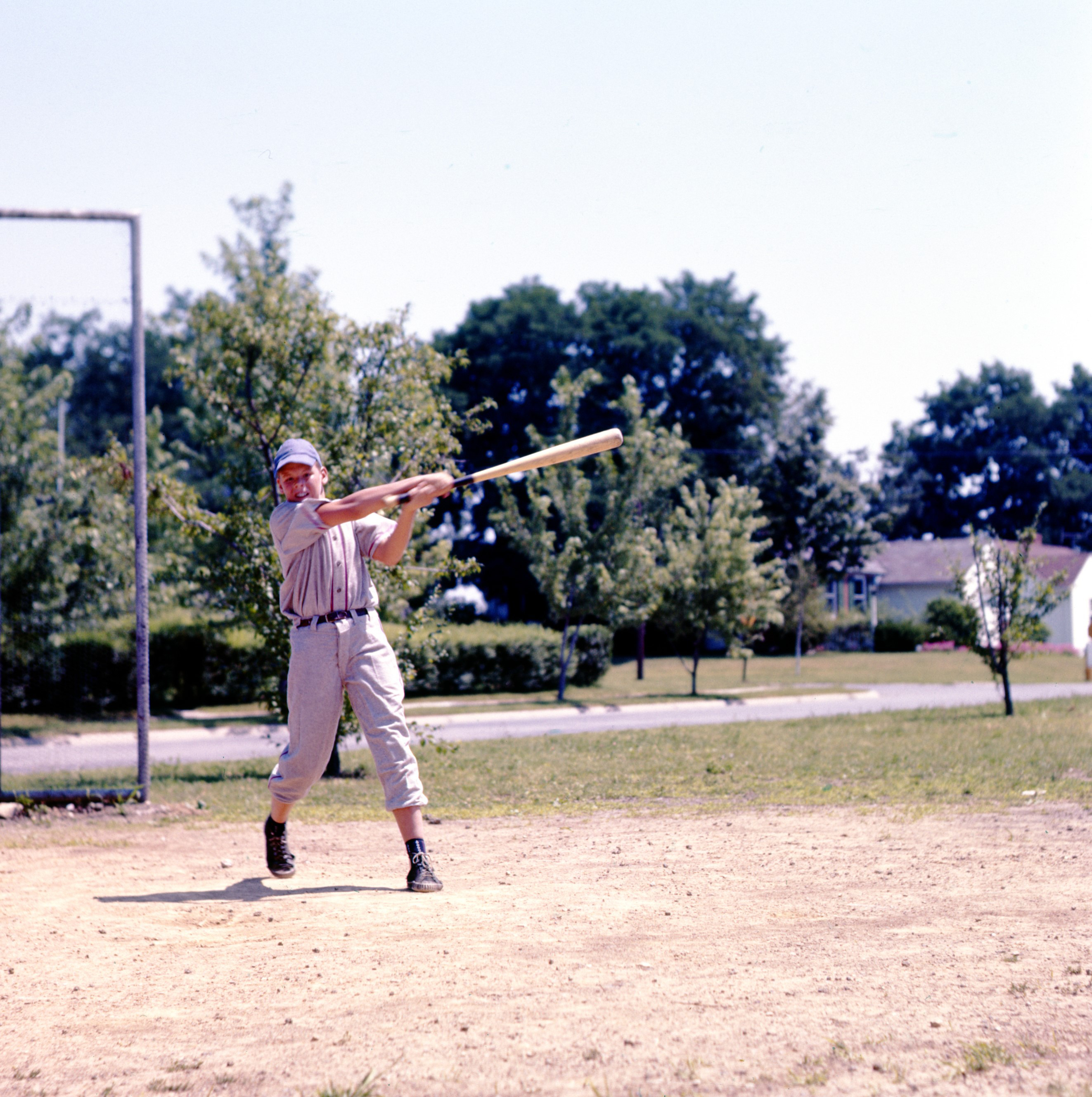 Color photo of a boy playing baseball