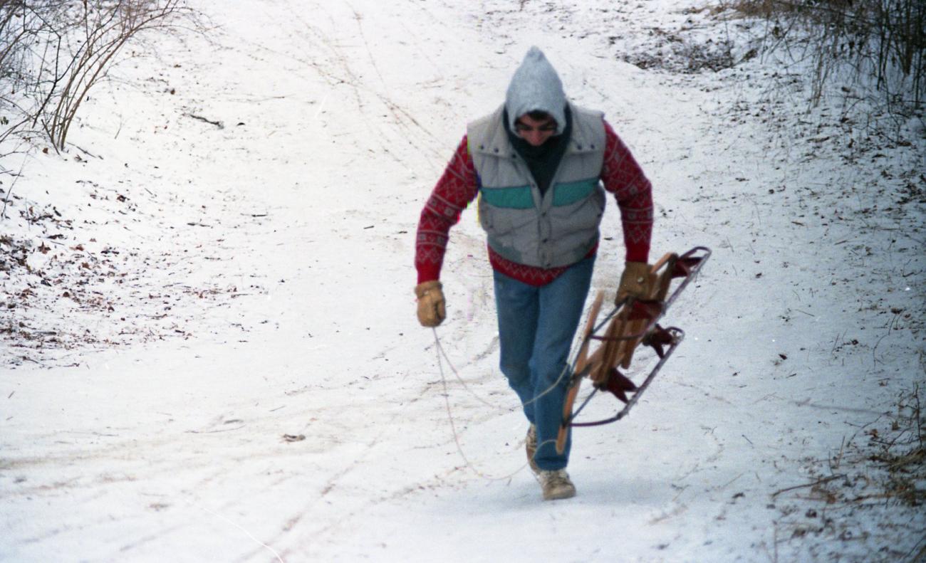 Andy Shirk Walking Up "Devil's Hill" Sled Run