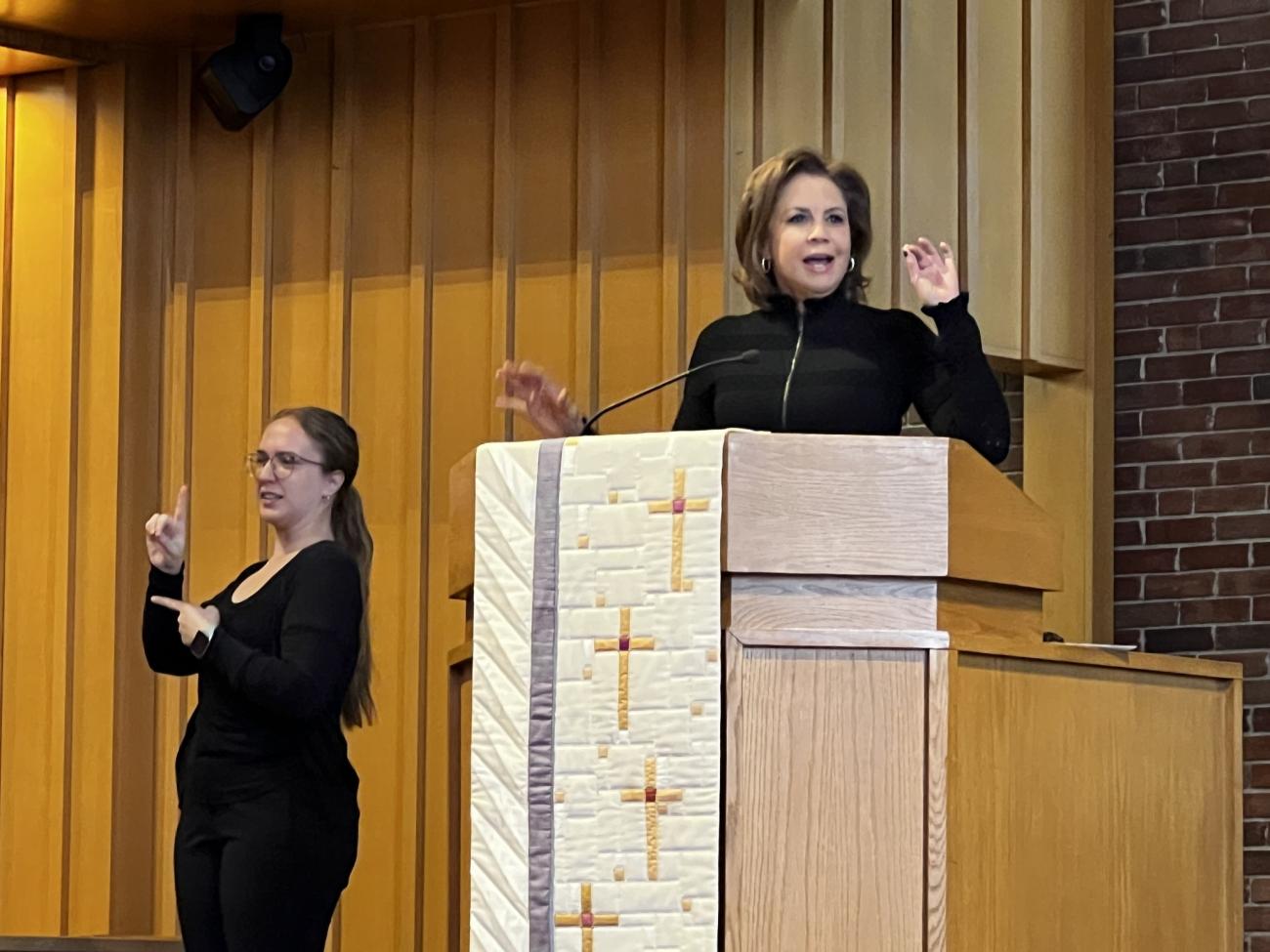 Color photo of Dana Tyler and Sign Language Interpreter at the 2025 Martin Luther King Day Celebration