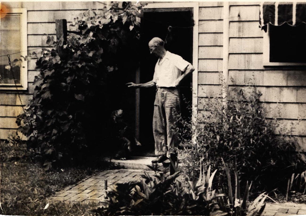 Elmer Gloyd Standing Outside of His Home