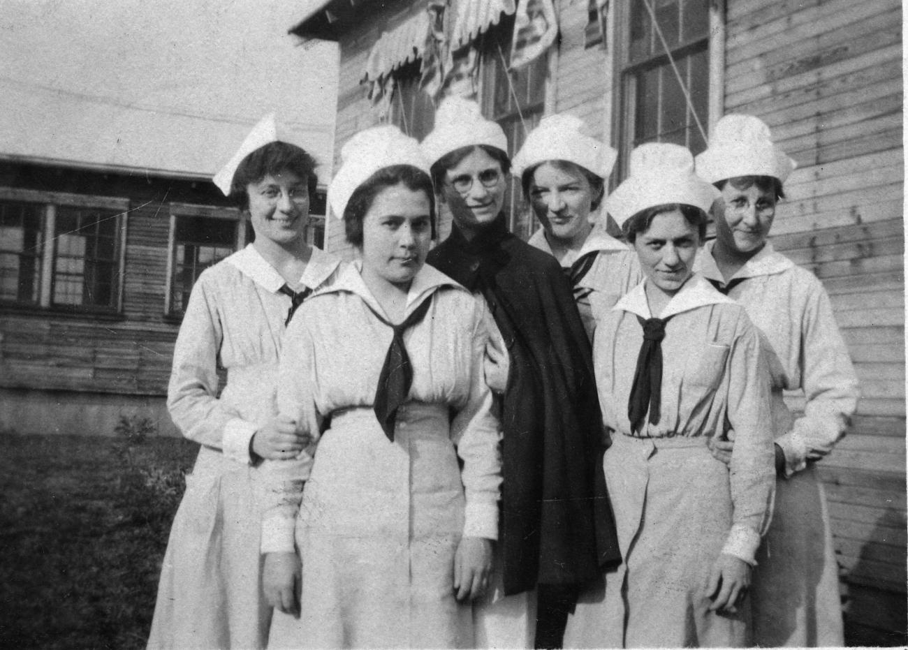 Black and white photograph of six women in World War I Army nurse uniform facing the camera