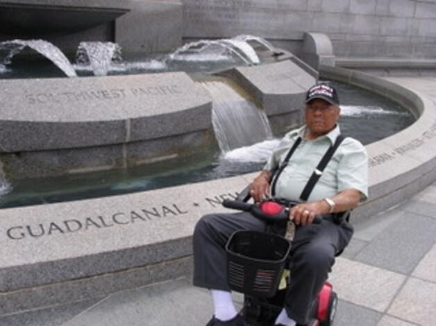 Color photo of Herbert McGee at World War II Memorial Fountain in Washington, D.C.