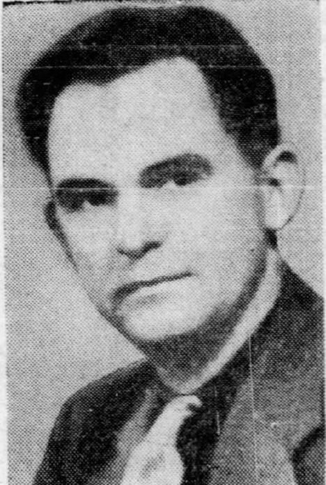 Black and white reproduction of a portrait photo featuring a man in suit looking at camera with neutral expression