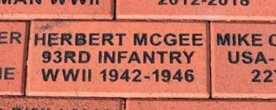 Color photo of a Memorial Brick for Herbert McGee at Motts Military Museum