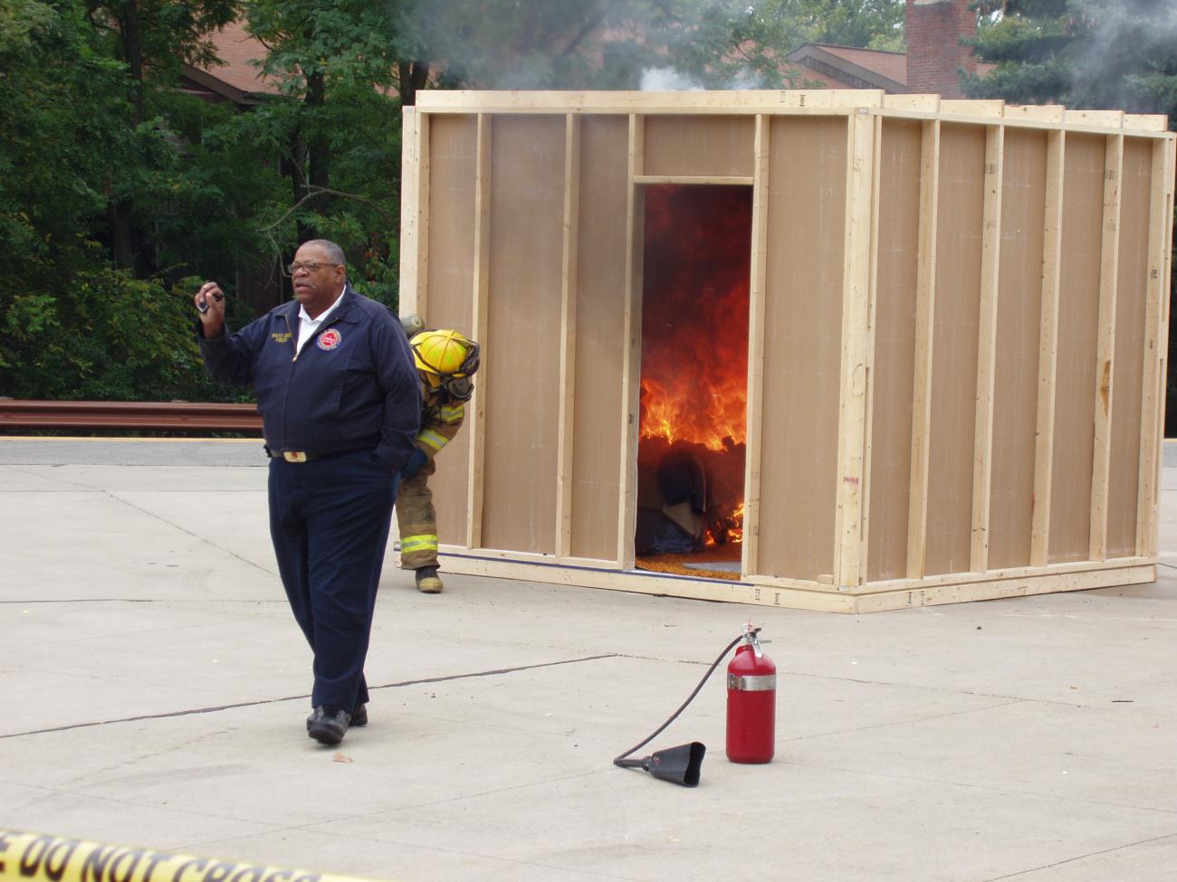 Photograph of Chief William (Bill) Fields, Jr. Narrating Fire Safety Demonstration