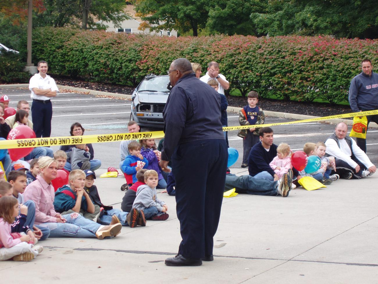 Photograph of Chief William (Bill) Fields, Jr. Speaking to Crowd During Fire Safety Demonstration