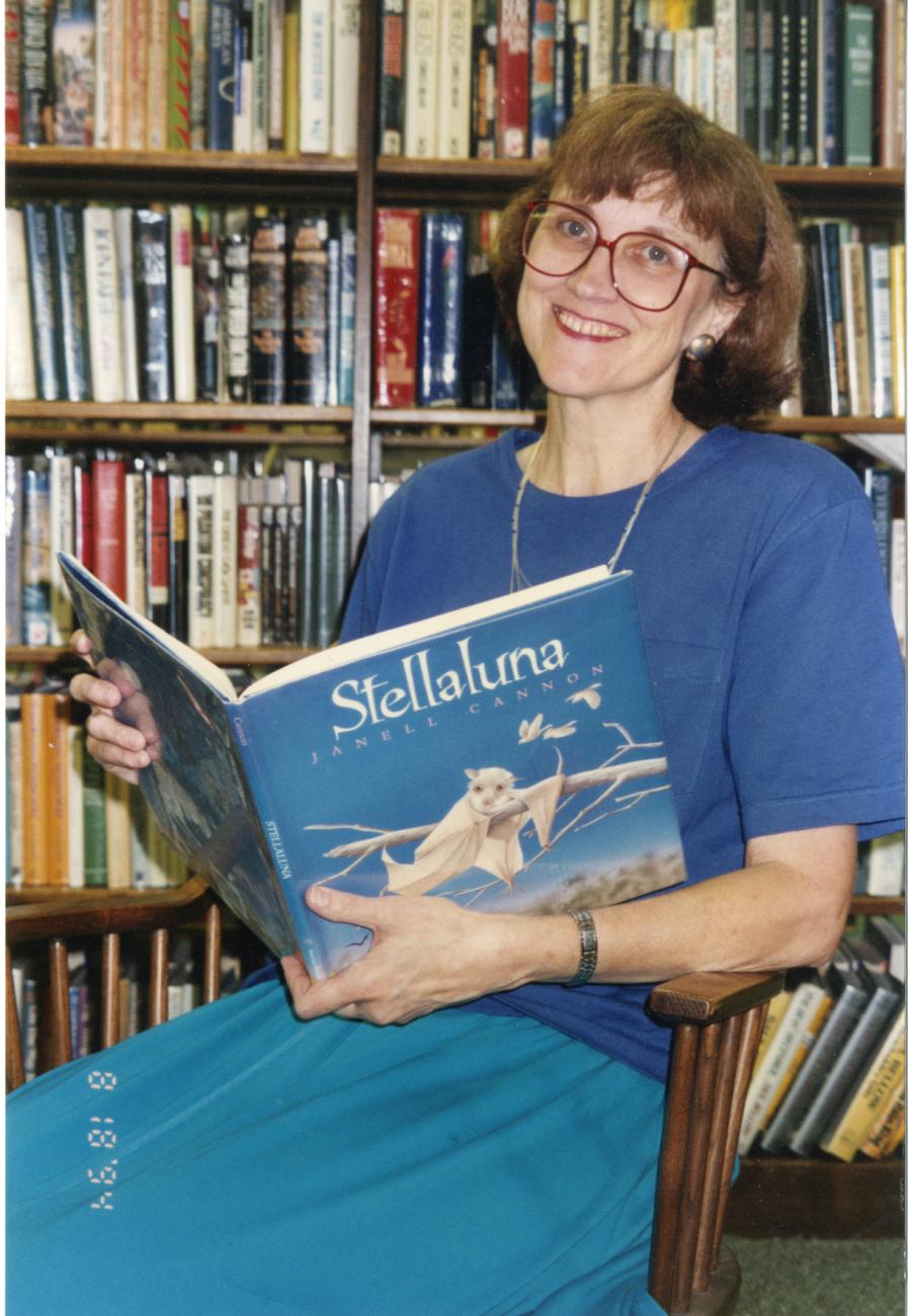 Photograph of Librarian Jo Osborne Holding the Book "Stellaluna"