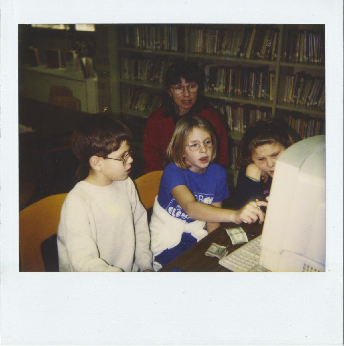 Photograph of Librarian Rachel Alexander with Children Using Computer, Old Worthington Library