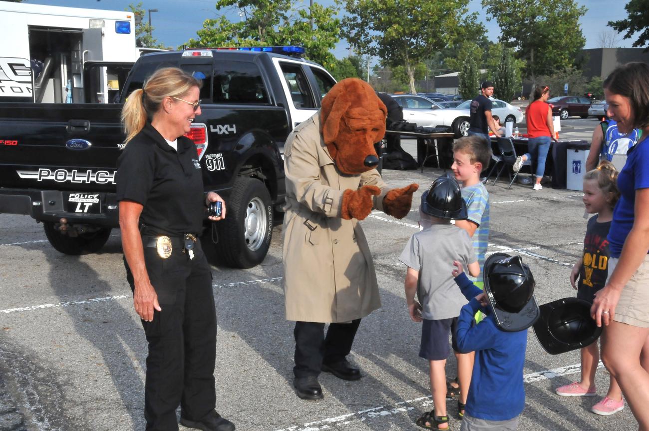 Photograph of Lieutenant Jennifer Wuertz with McGruff the Crime Dog