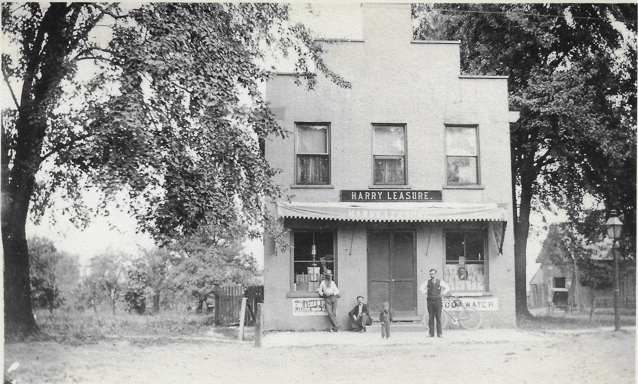 Photograph of the Harry Leasure Drug Store at the Corner of High St. and New England Ave.