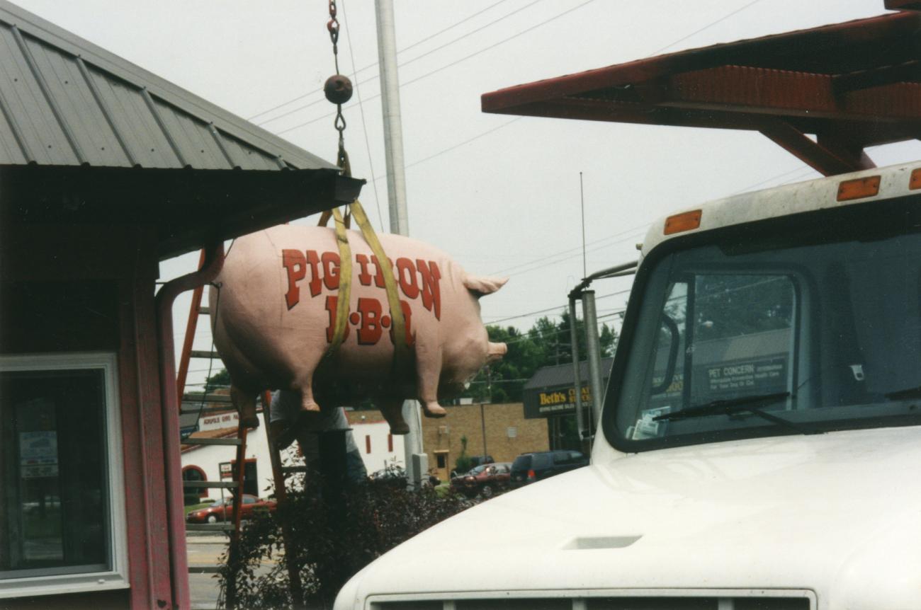 Pig Iron BBQ Pig Statue Being Lifted into Place