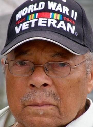 Color photograph of Herbert McGee in World War II Veteran baseball cap