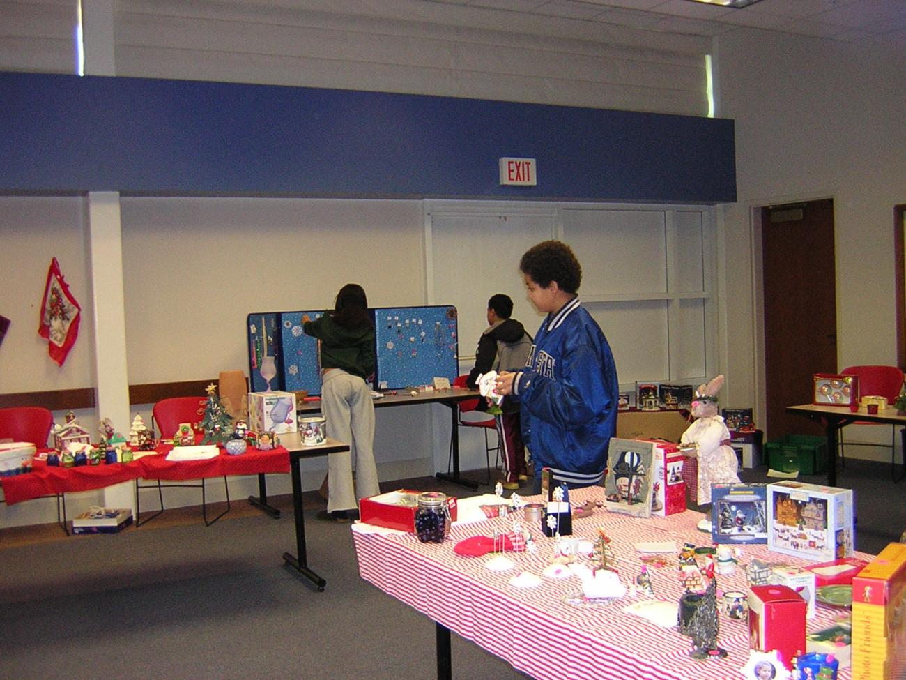 Teens Amid Tables of Goods at the 2006 Holiday Bazaar