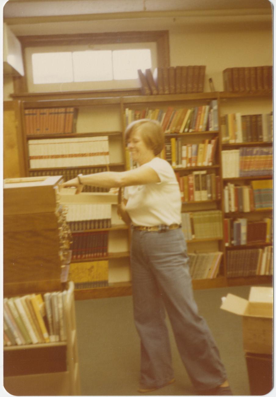 Worthington Public Library Director Bernice Daniels Throwing Away Cards from Card Catalog