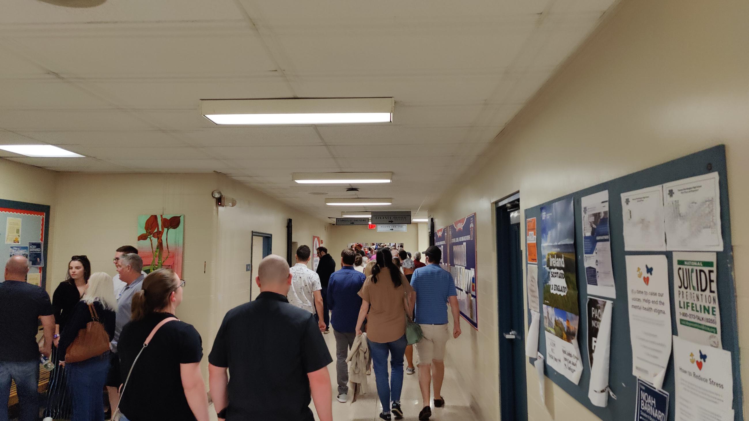 Attendees at the Thomas Worthington High School Alumni Tour, Shown Walking Down a Hallway