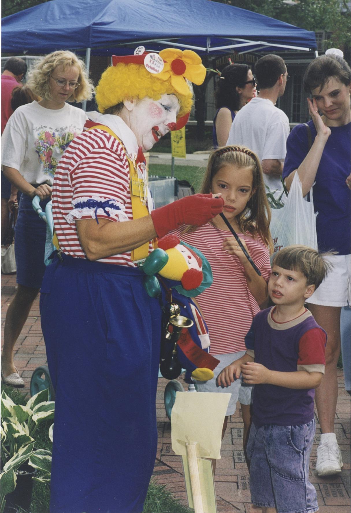 Clown Making Balloon Animals for Children at the Worthington Farmer's Market