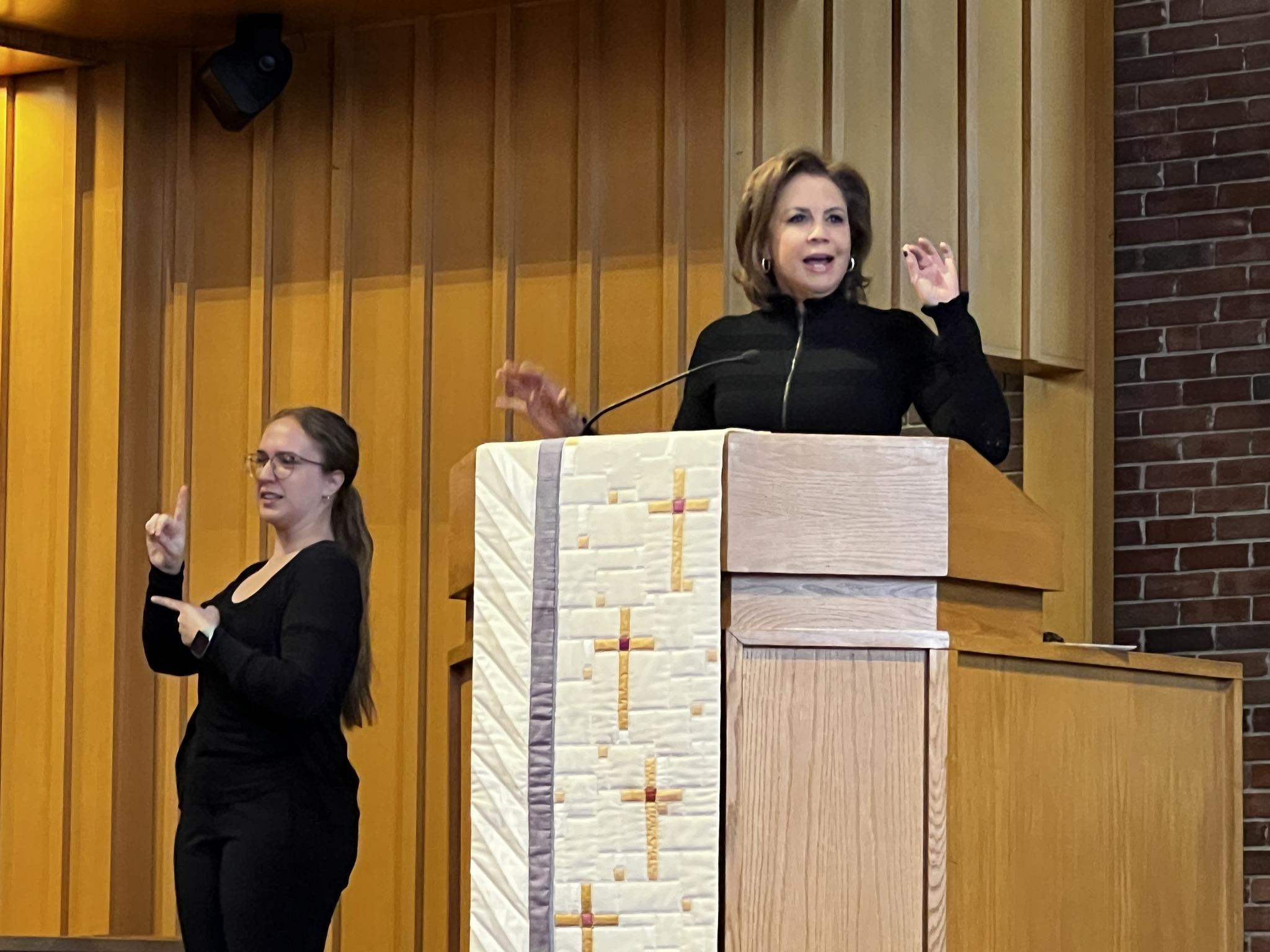 Color photo of Dana Tyler and Sign Language Interpreter at the 2025 Martin Luther King Day Celebration