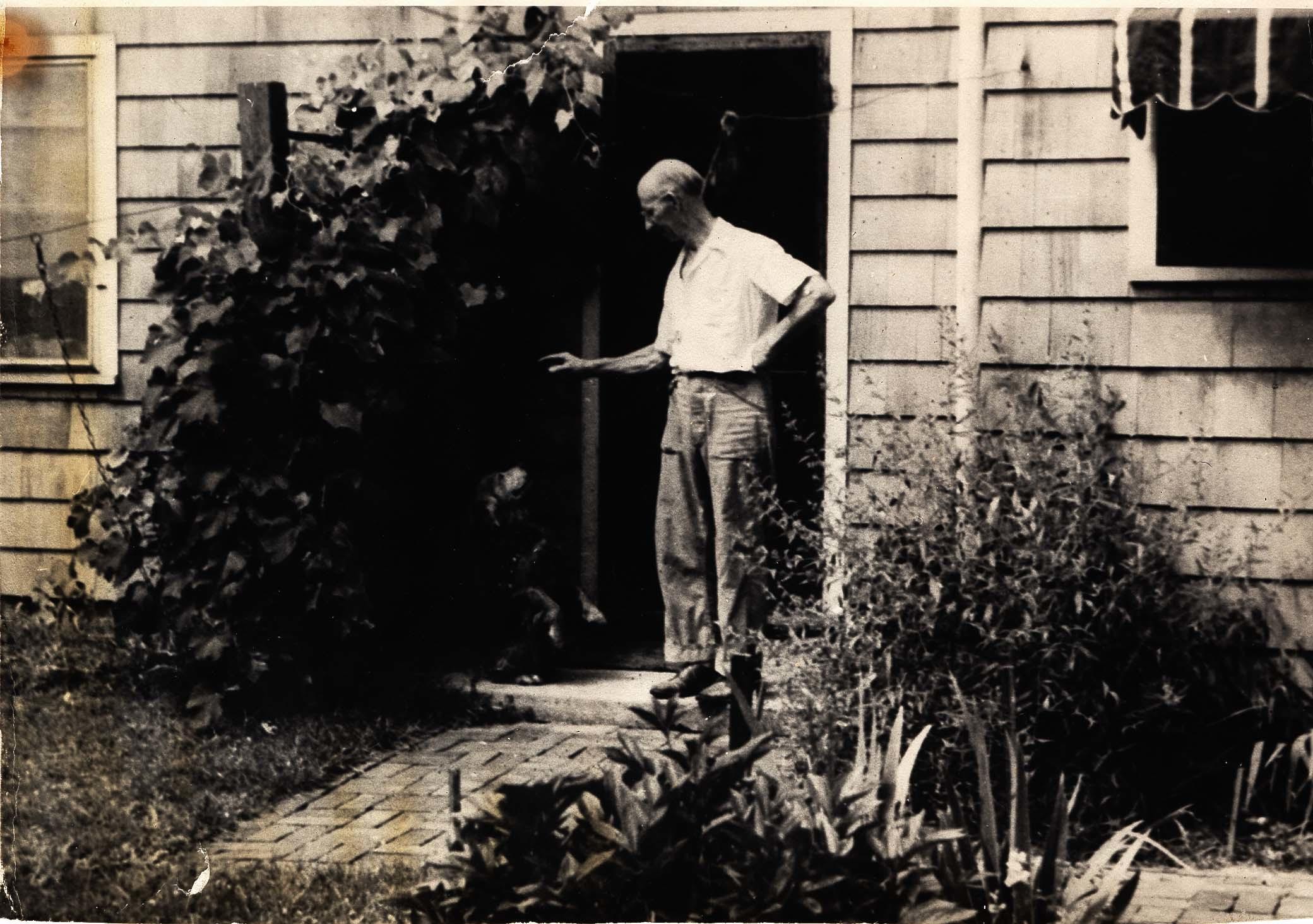 Elmer Gloyd Standing Outside of His Home