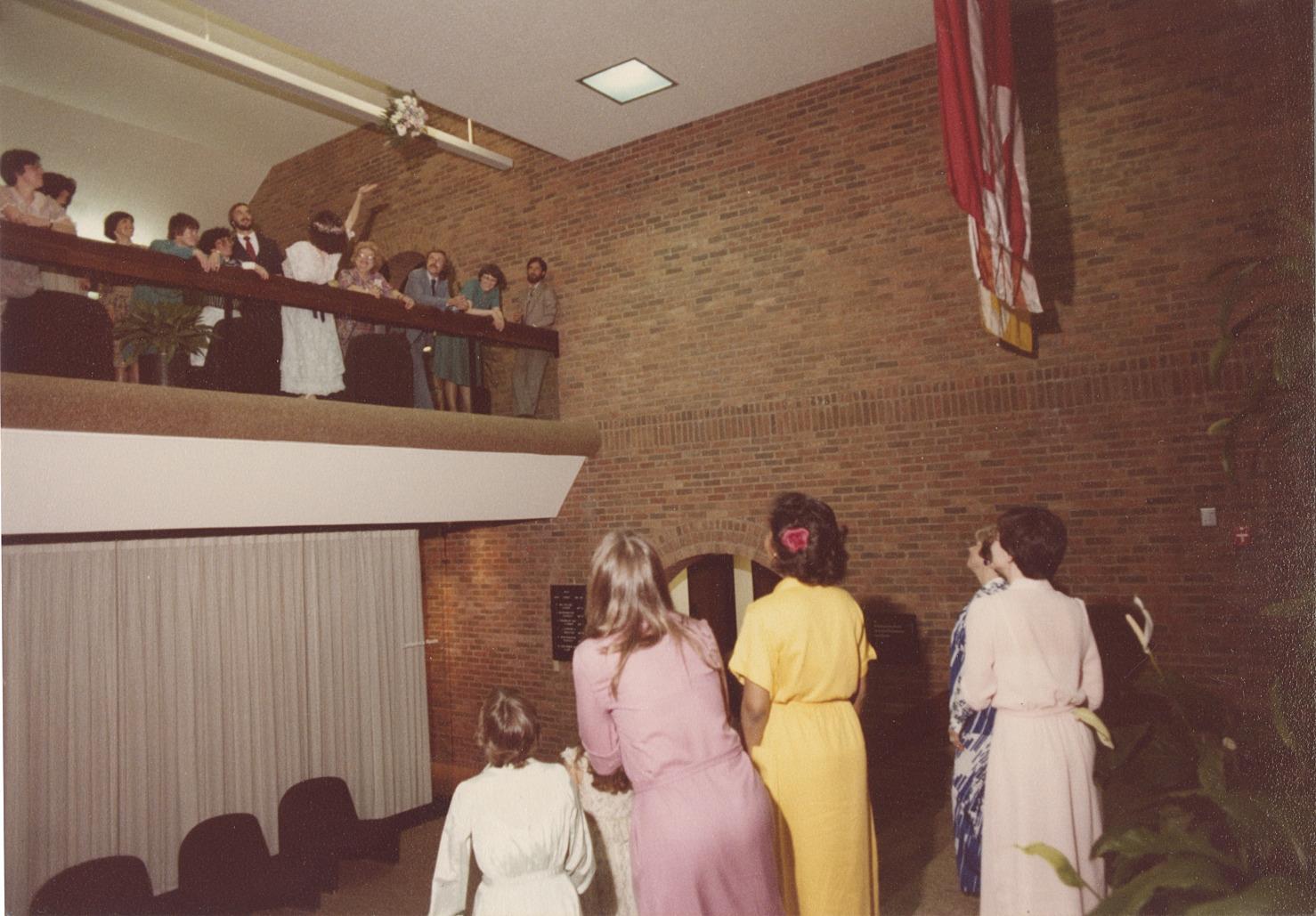 Photograph of Bouquet Toss at Wedding in the Old Worthington Library, May 8, 1982
