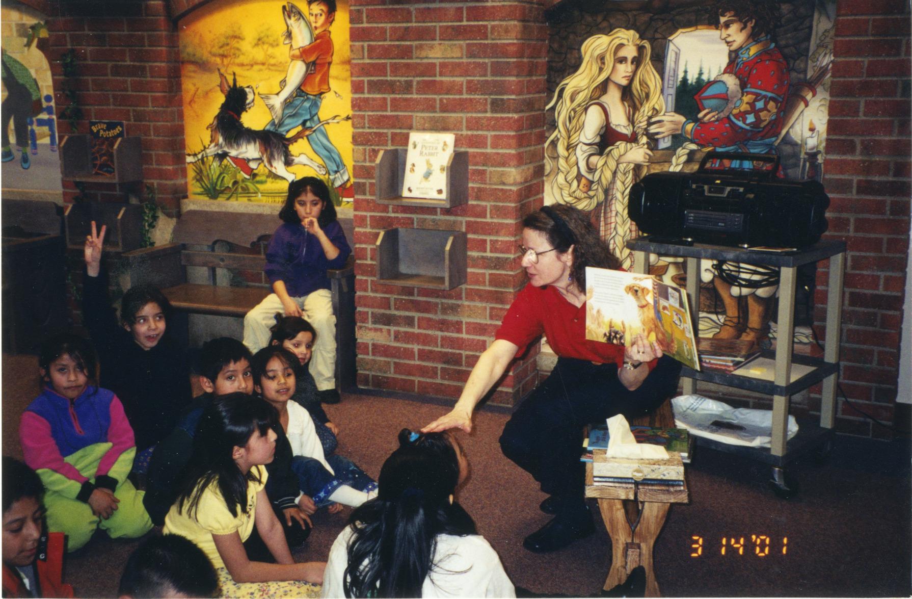 Photograph of Librarian Rachel Alexander with Children at Bilingual Storytime