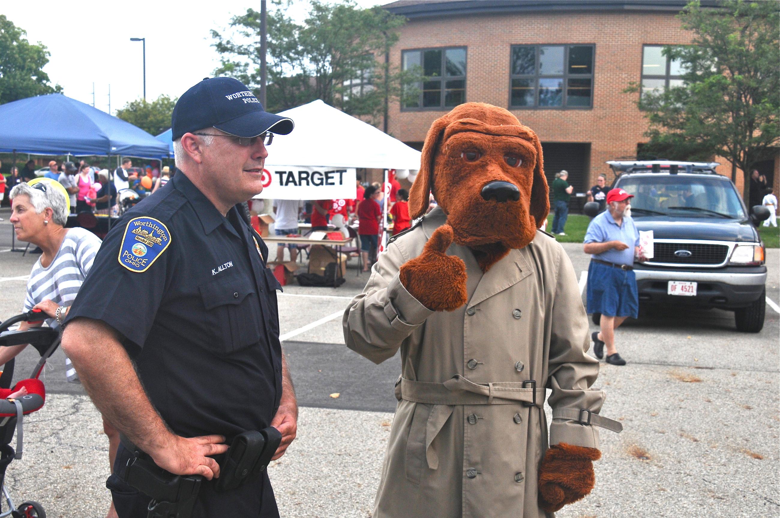 Photograph of Officer Kirk Allton with McGruff the Crime Dog