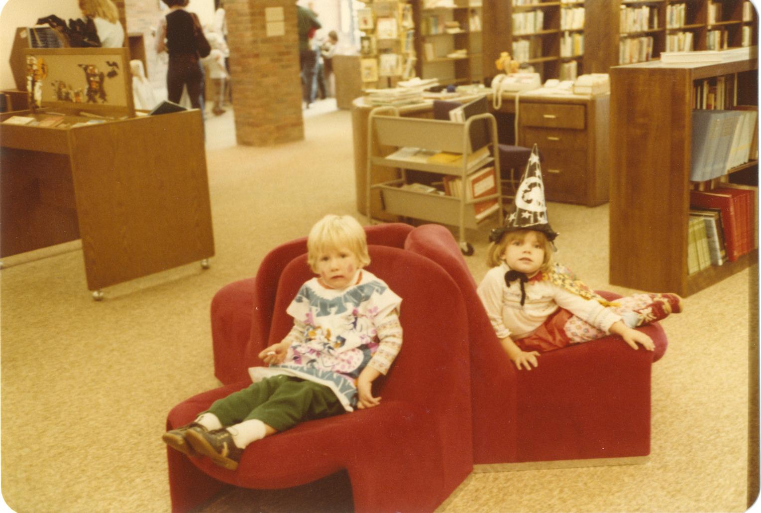 Photograph of Two Children in Costume Seated at Halloween, Old Worthington Library