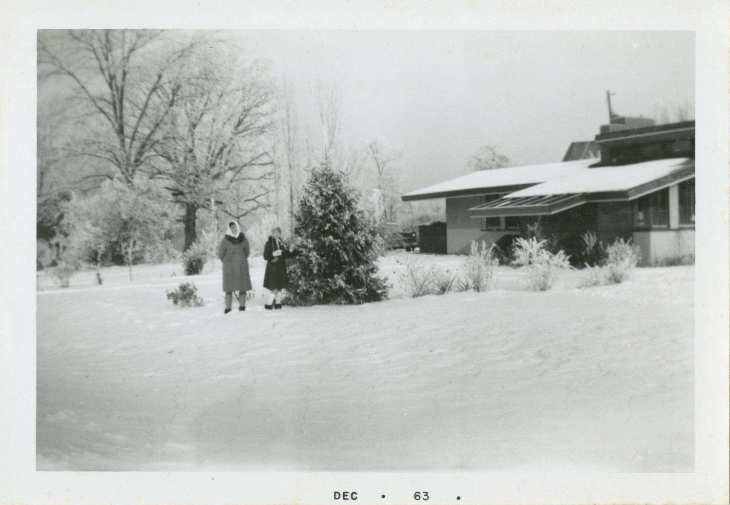 Photograph of Two People Standing in Snow in front of 312 E. South Street
