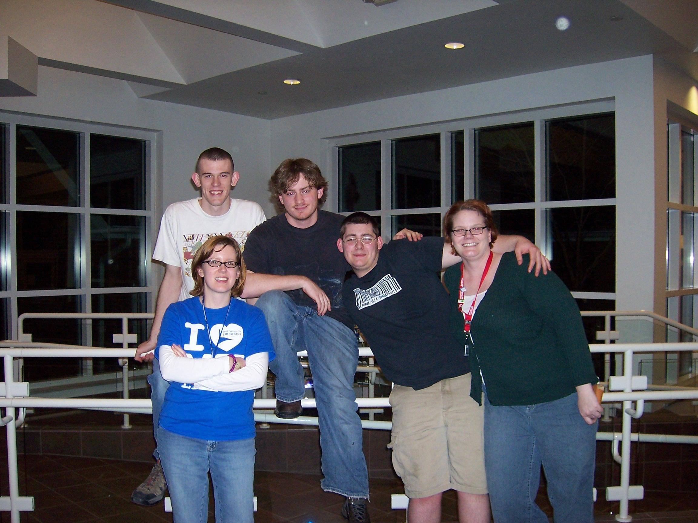 Photograph of librarians Ann Pechacek and Sarah Cofer with teens at a TGIF Program