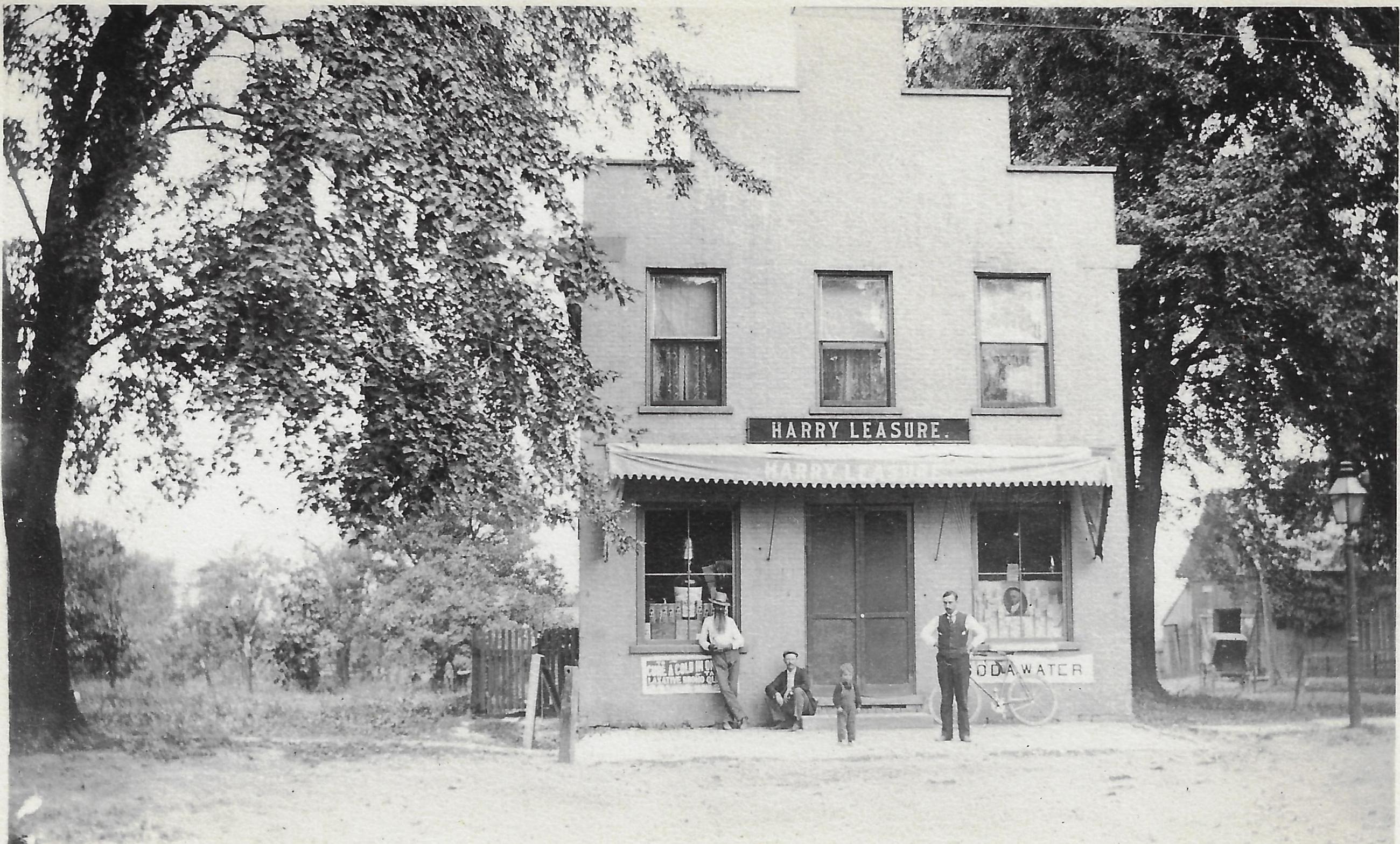 Photograph of the Harry Leasure Drug Store at the Corner of High St. and New England Ave.
