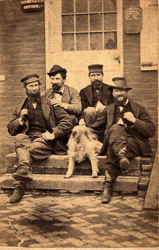 Sepia Photograph of Four Men and Dog