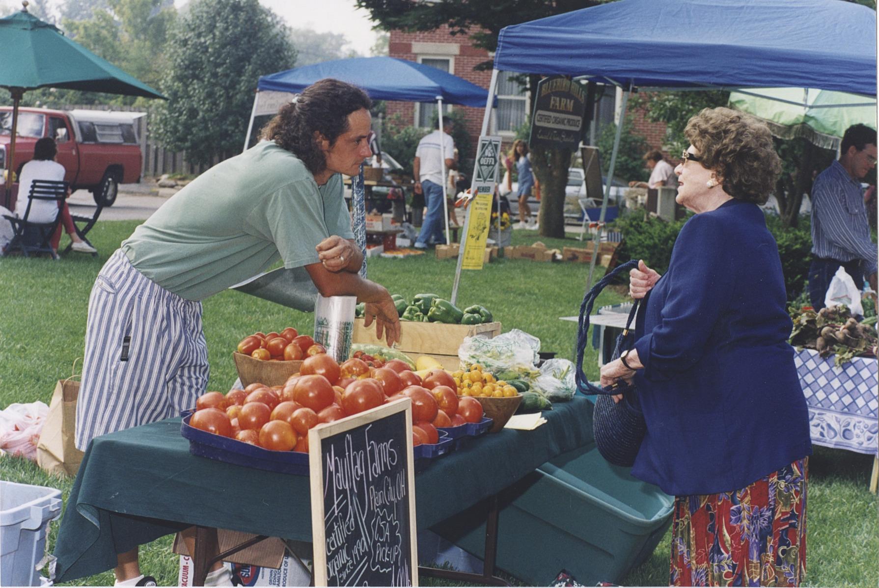 Shopper and Vegetable Vendor at the Worthington Farmer's Market