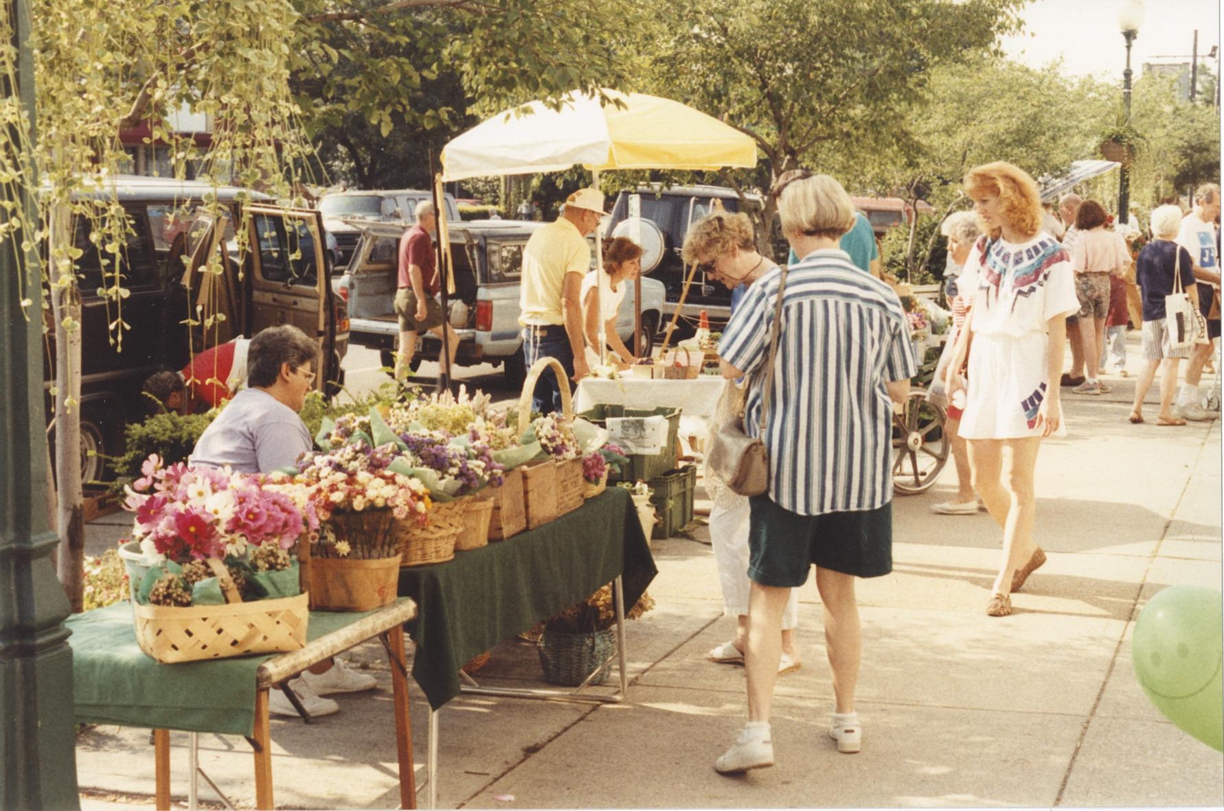 Shoppers Viewing Dried Flower Arrangements at the Worthington Farmer's Market