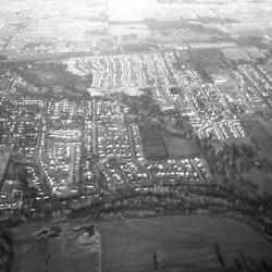 Black and white aerial photo of neighborhoods