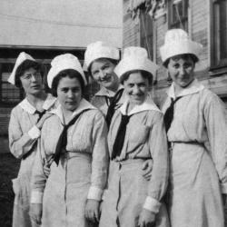 Black and white photograph of five women in World War I Army nurse uniform