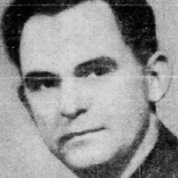 Black and white reproduction of a portrait photo featuring a man in suit looking at camera with neutral expression