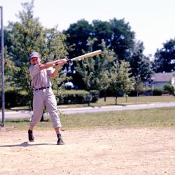 Color photo of a boy playing baseball