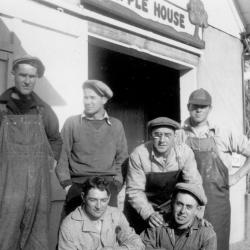 Photograph of Brown Fruit Farm Workers Outside of the Apple House