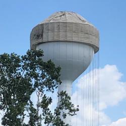 Photograph of Tarp Being Lowered Over Worthington Hills Water Tower Before Repainting, 2020