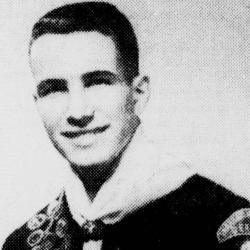 Black and white portrait of a smiling young man in military uniform