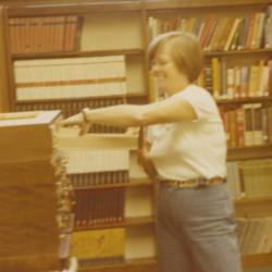 Worthington Public Library Director Bernice Daniels Throwing Away Cards from Card Catalog