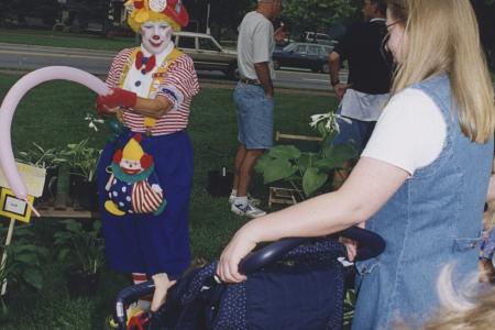 Clown Making Balloon Animal for Child in Stroller at Worthington Farmers Market