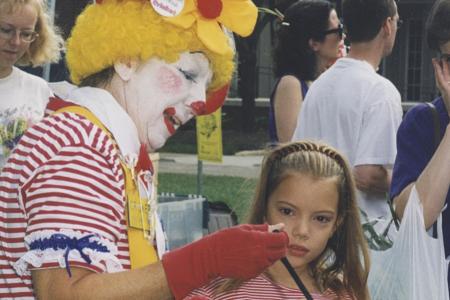 Clown Making Balloon Animals for Children at the Worthington Farmer's Market