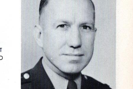 Black-and-white photo of man in military uniform in a yearbook with name, title, family members and address given