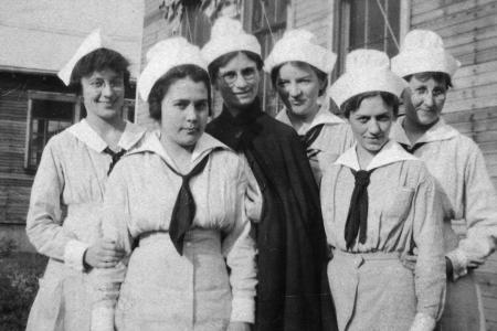 Black and white photograph of six women in World War I Army nurse uniform facing the camera