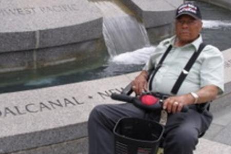 Color photo of Herbert McGee at World War II Memorial Fountain in Washington, D.C.