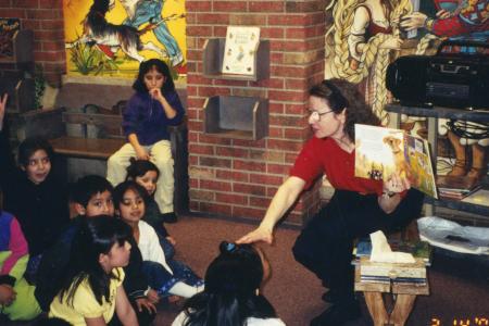 Photograph of Librarian Rachel Alexander with Children at Bilingual Storytime