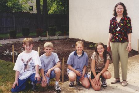 Photograph of Rachel Alexander with Children in Storybook Garden at Northwest Library