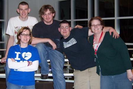 Photograph of librarians Ann Pechacek and Sarah Cofer with teens at a TGIF Program