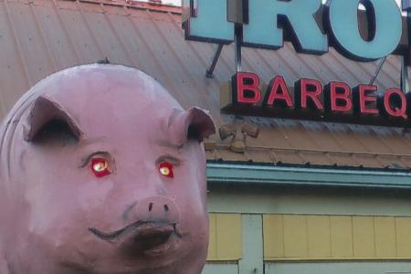 Pig Sign and Storefront for the Iron Grill Barbeque & Brew