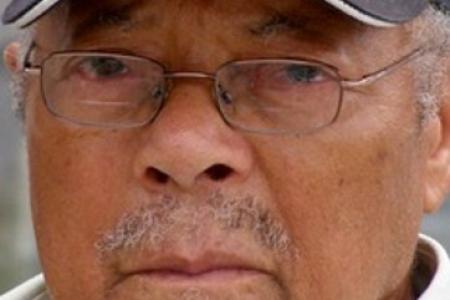 Color photograph of Herbert McGee in World War II Veteran baseball cap